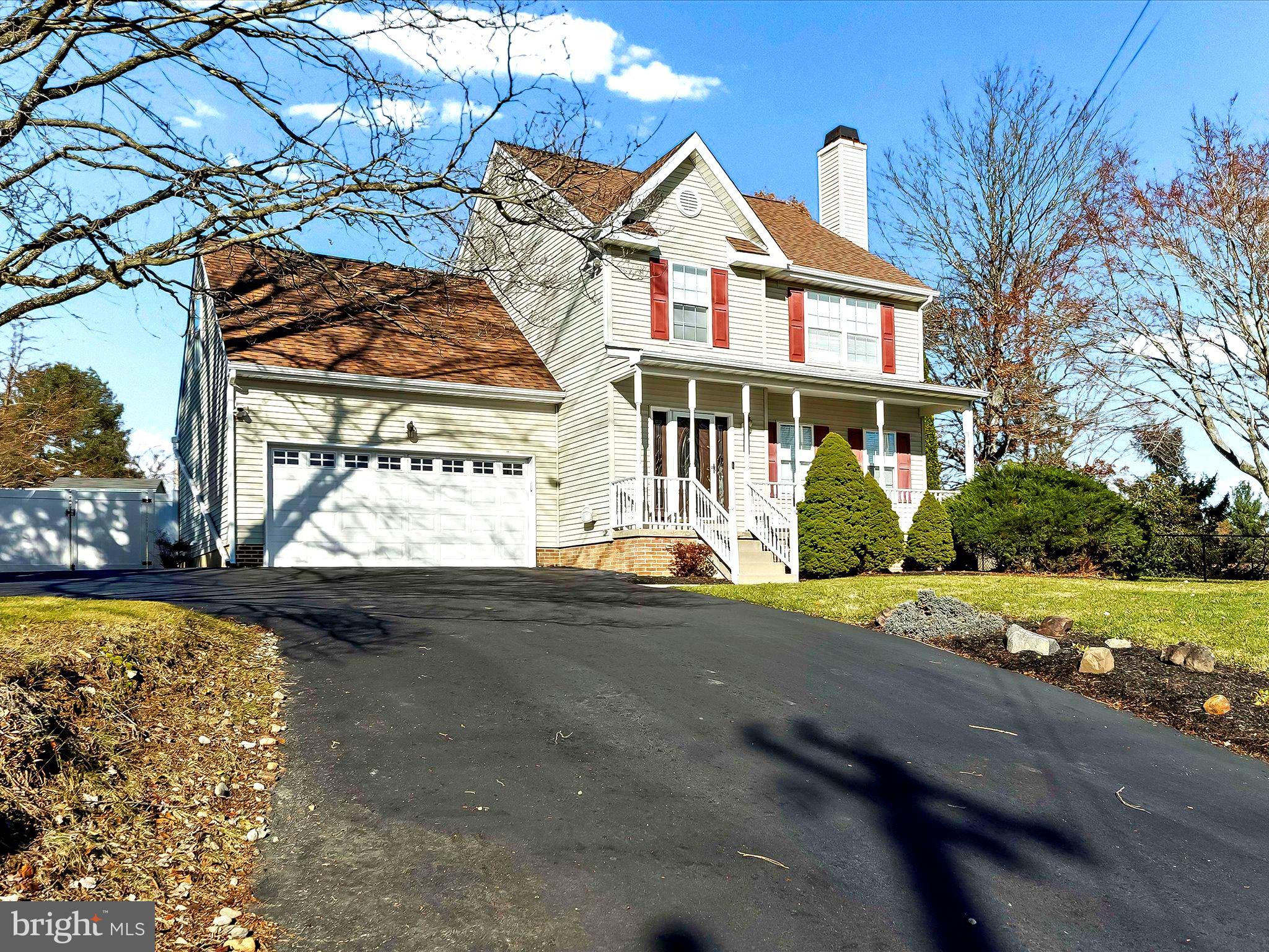 2410 Larkin Road Upper Chichester, PA 19061 - Photo 40 of 50 a front view of a house with a yard and garage