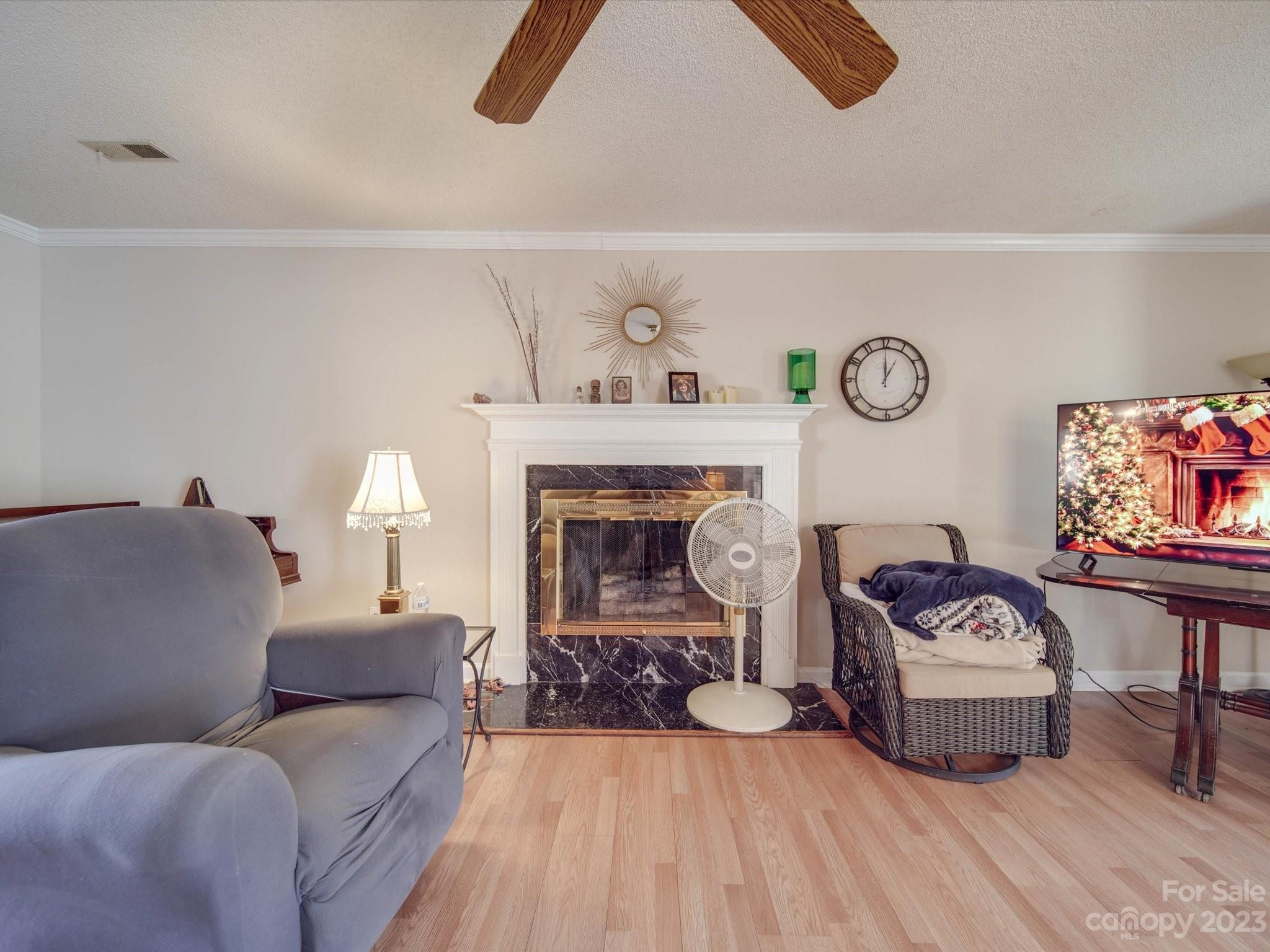 8009 Lighthouse Way Indian Trail, NC 28079 - Photo 2 of 26 a living room with furniture and a fireplace