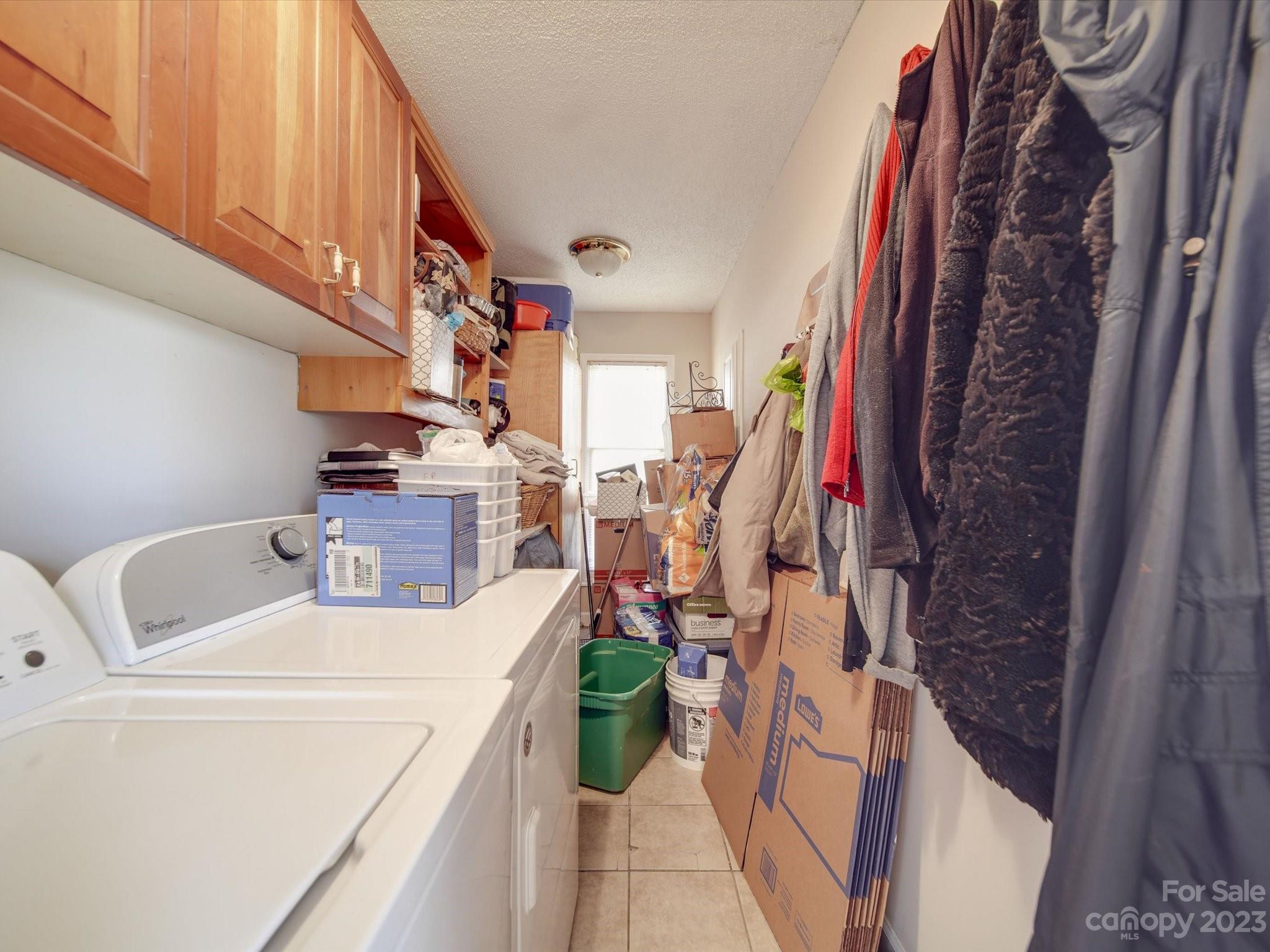 8009 Lighthouse Way Indian Trail, NC 28079 - Photo 22 of 26 a view of walk in closet with clothes and shoes