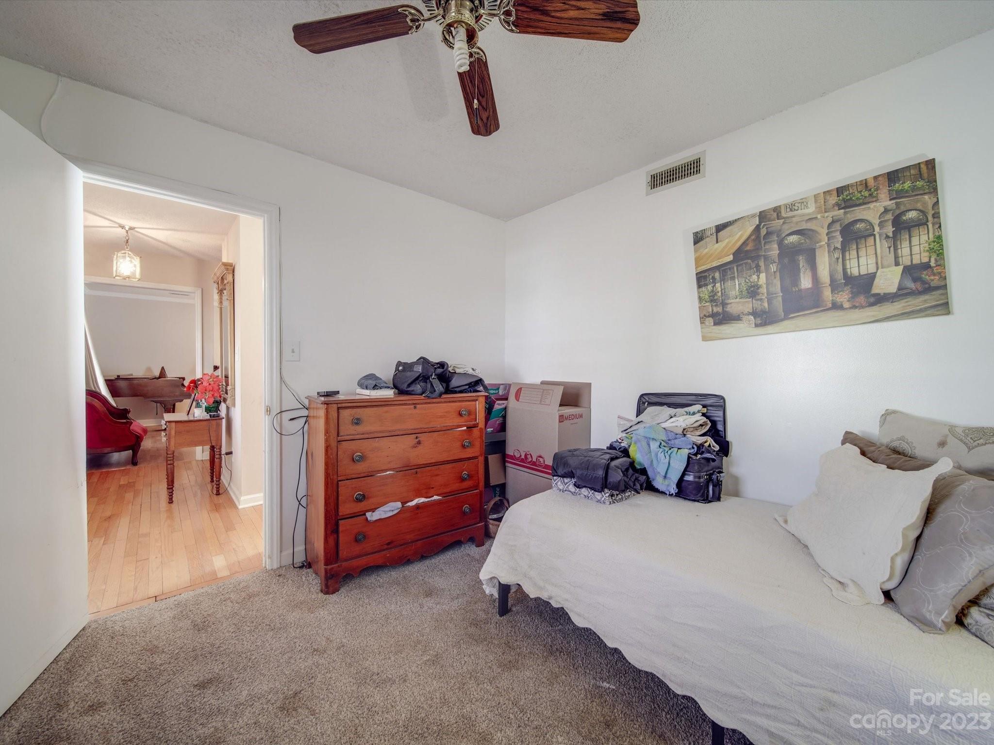 8009 Lighthouse Way Indian Trail, NC 28079 - Photo 7 of 26 a bedroom with furniture and a bed