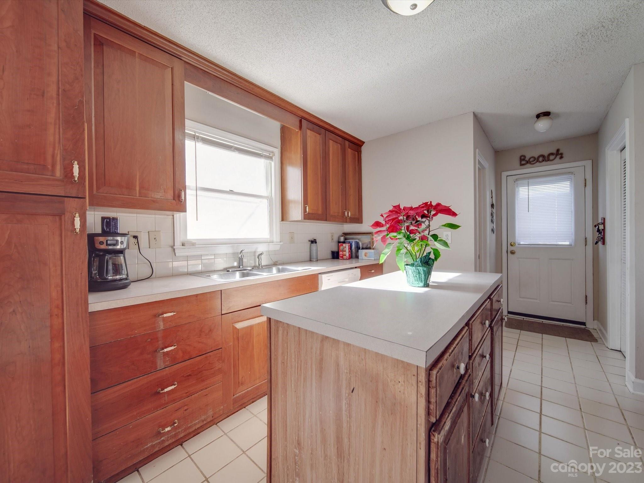 8009 Lighthouse Way Indian Trail, NC 28079 - Photo 9 of 26 a kitchen with a sink cabinets and window