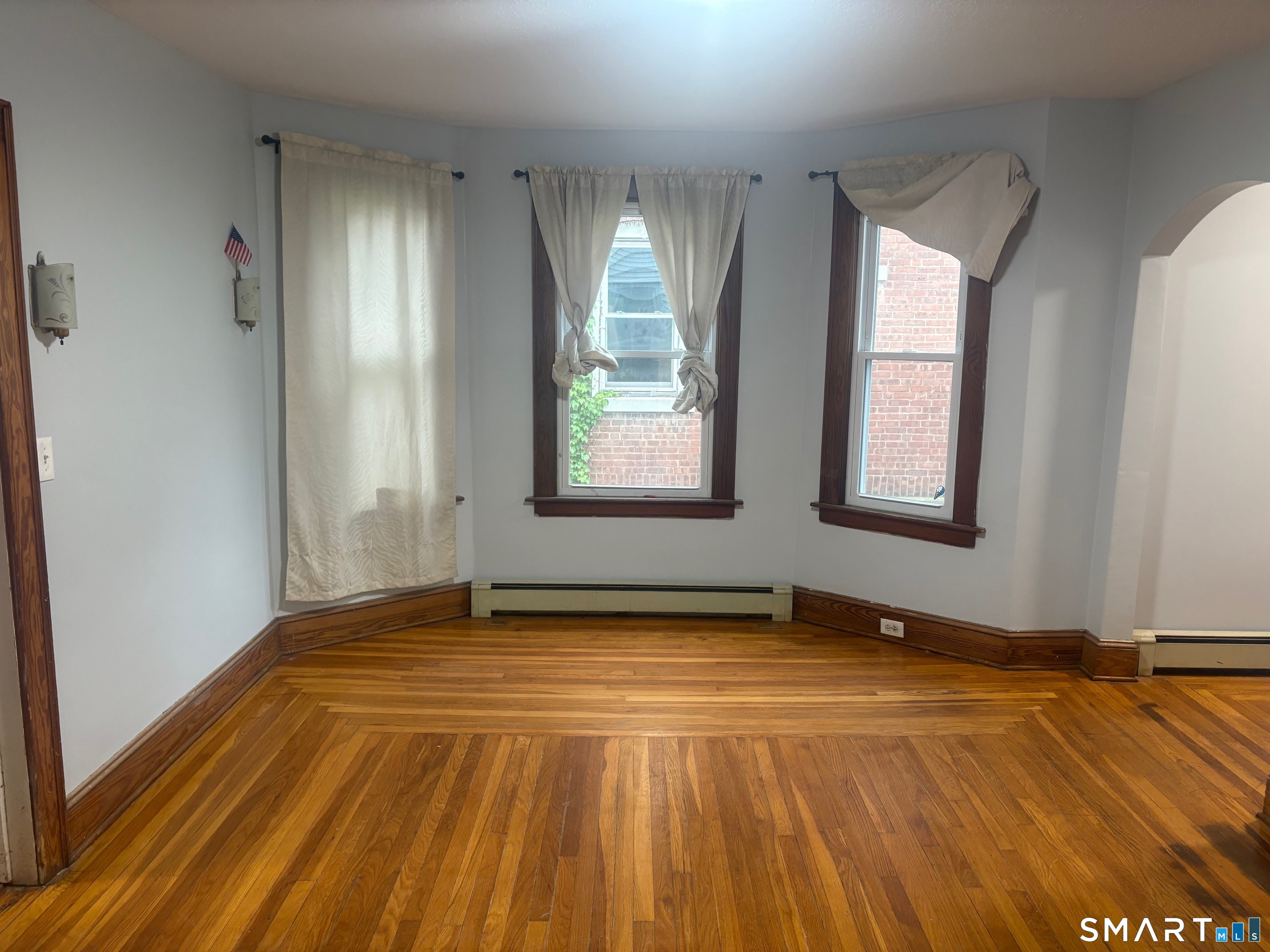 580 High Street Middletown, CT 06457 - Photo 9 of 11 an empty room with wooden floor and windows