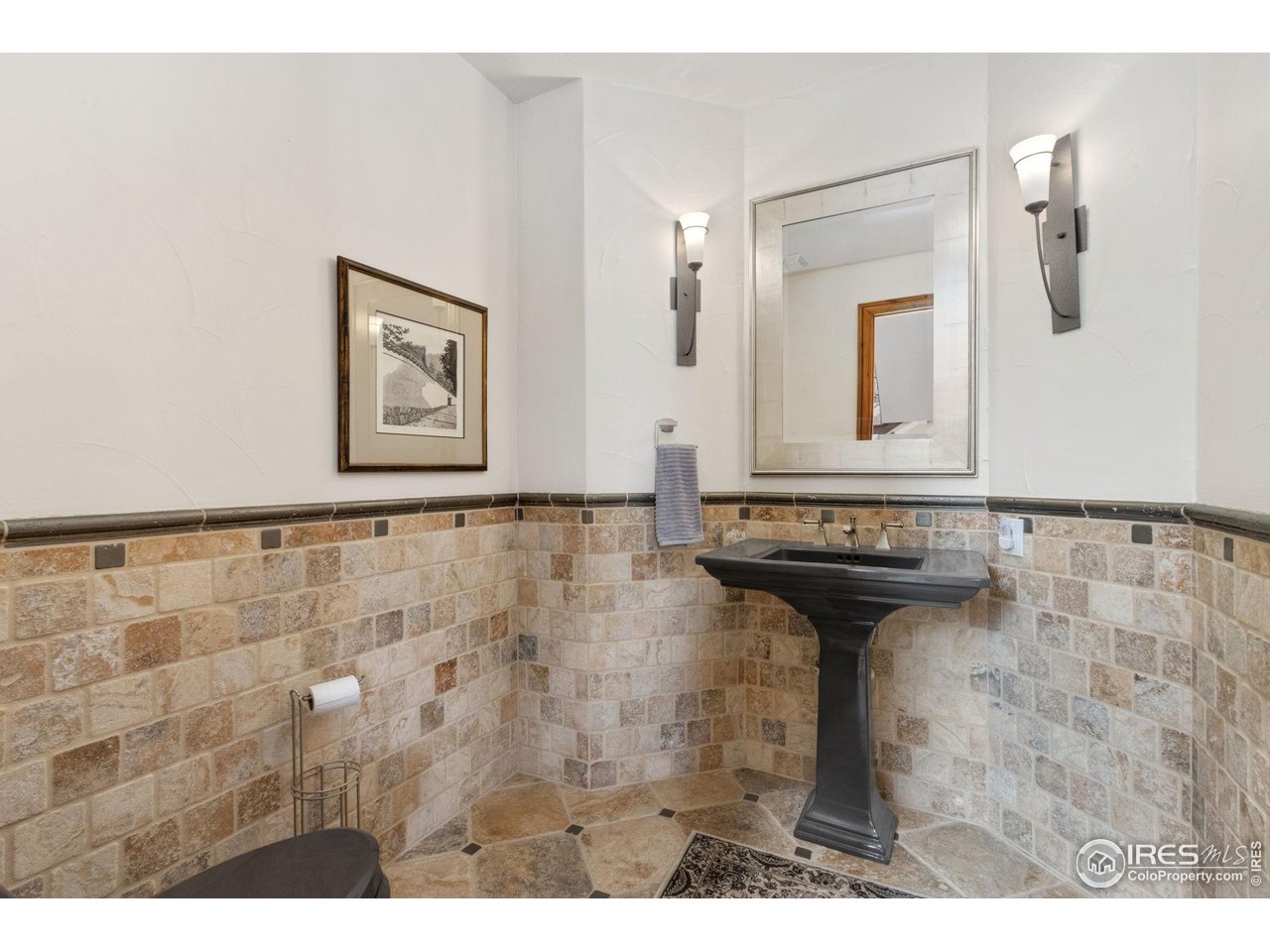 8467 Golden Eagle Road Fort Collins, CO 80528 - Photo 15 of 40 a bathroom with a sink and a mirror
