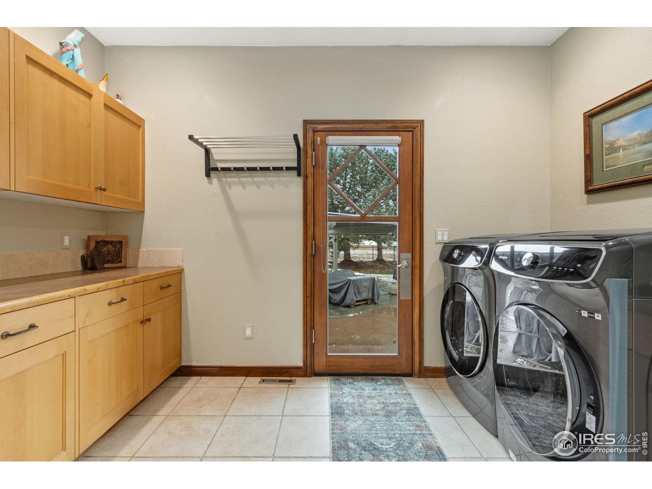 8467 Golden Eagle Road Fort Collins, CO 80528 - Photo 17 of 40 a utility room with dryer and washer