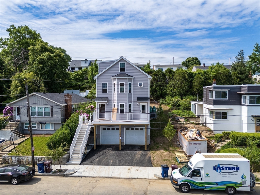 216 Vane Street, Unit 1 Revere, MA 02151 - Photo 20 of 22 an aerial view of a house with a garden and plants