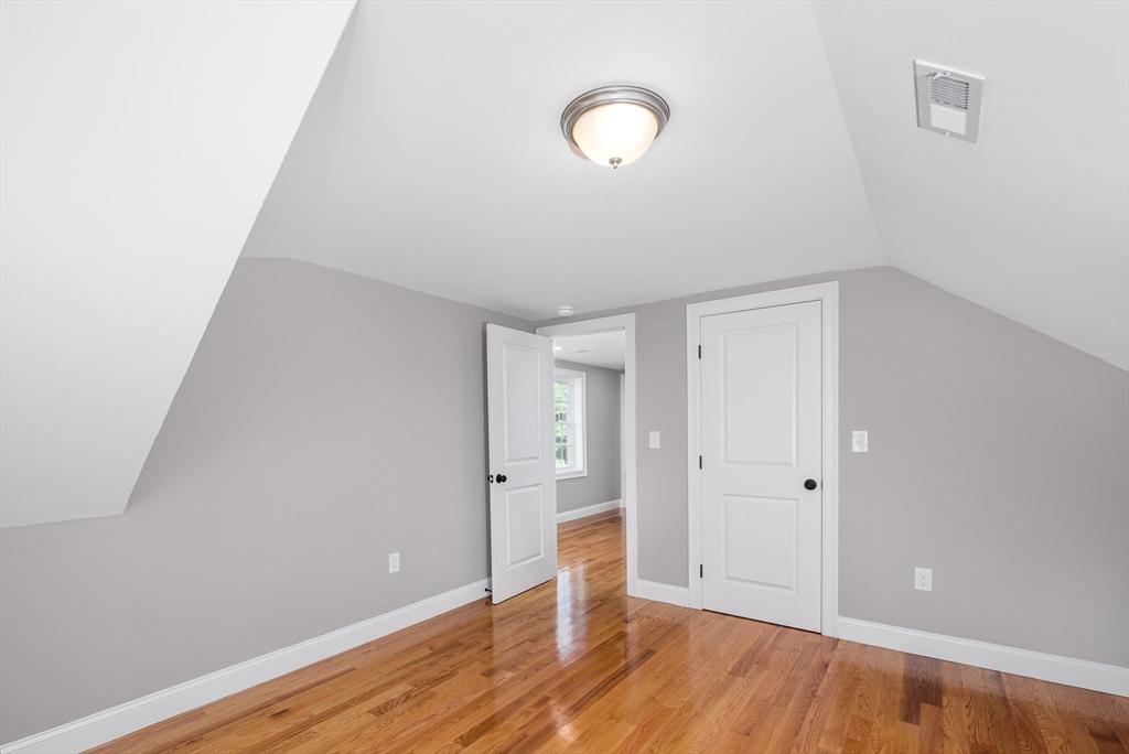 216 Vane Street, Unit 1 Revere, MA 02151 - Photo 5 of 22 a view of an empty room with wooden floor