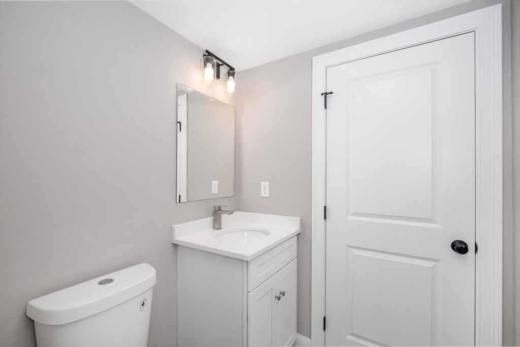 216 Vane Street, Unit 1 Revere, MA 02151 - Photo 6 of 22 a bathroom with a sink a toilet and shower