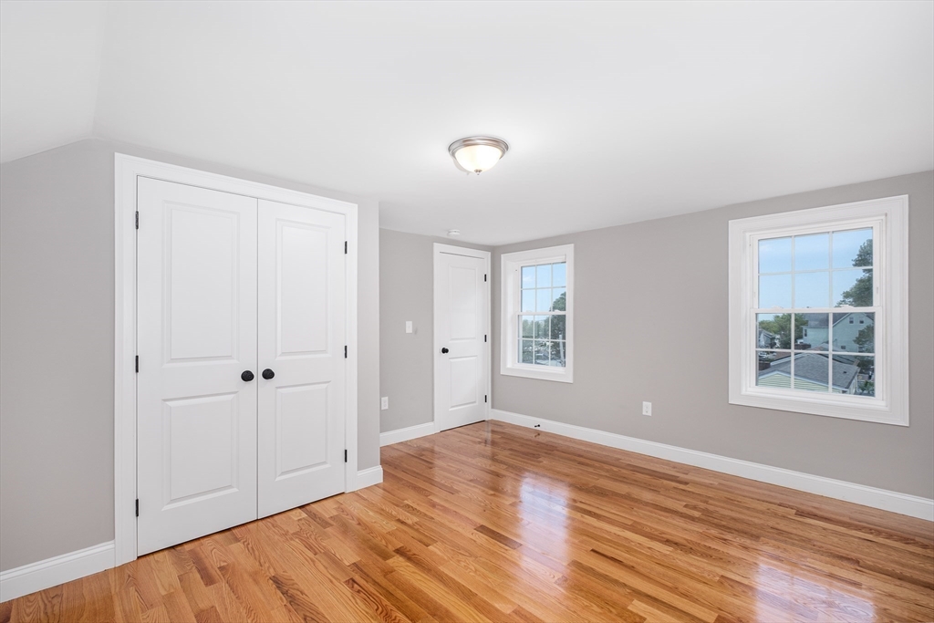 216 Vane Street, Unit 1 Revere, MA 02151 - Photo 8 of 22 a view of a room with wooden floor and windows