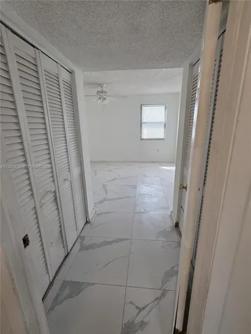 a bathroom with a shower and a sink