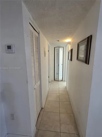 a view of hallway with windows