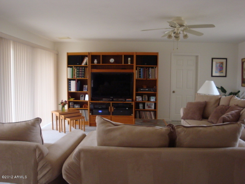 6933 East Doubletree Ranch Road Paradise Valley, AZ 85253 - Photo 15 of 30 a living room with furniture and a flat screen tv