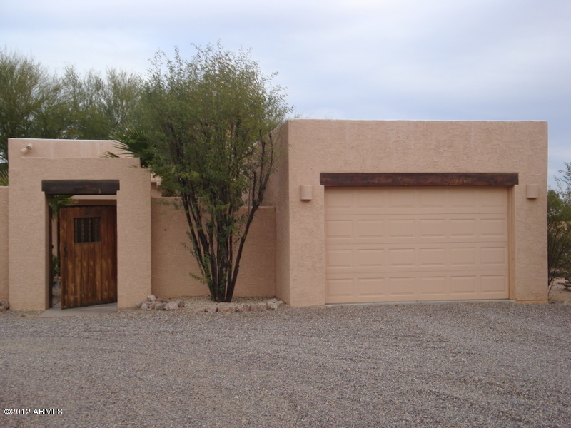 6933 East Doubletree Ranch Road Paradise Valley, AZ 85253 - Photo 21 of 30 a view of a house with a garage