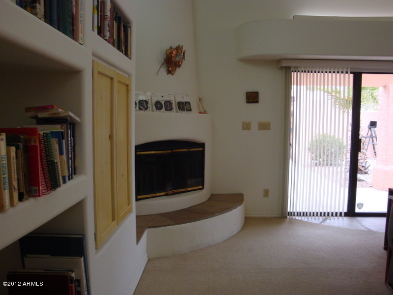 6933 East Doubletree Ranch Road Paradise Valley, AZ 85253 - Photo 25 of 30 a view of a livingroom with an empty space and a fireplace