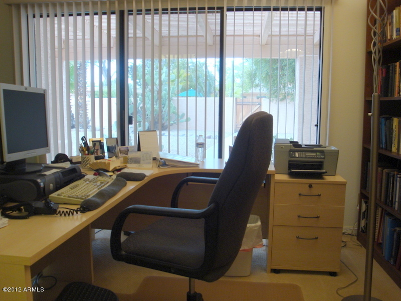 6933 East Doubletree Ranch Road Paradise Valley, AZ 85253 - Photo 26 of 30 a view of a workspace with furniture and a window
