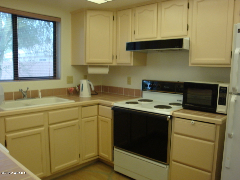6933 East Doubletree Ranch Road Paradise Valley, AZ 85253 - Photo 27 of 30 a utility room with sink dryer and washer