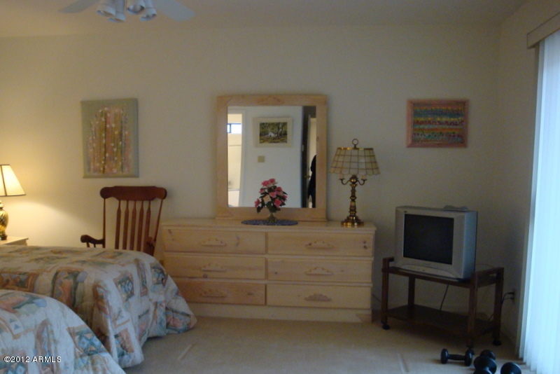 6933 East Doubletree Ranch Road Paradise Valley, AZ 85253 - Photo 29 of 30 a bedroom with a bed and a dresser