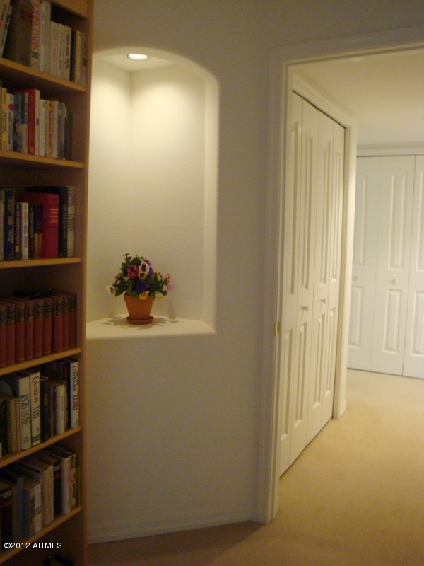 6933 East Doubletree Ranch Road Paradise Valley, AZ 85253 - Photo 30 of 30 a room with bookshelf and a window