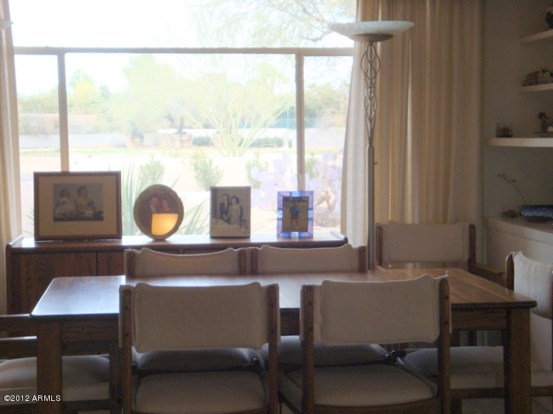 6933 East Doubletree Ranch Road Paradise Valley, AZ 85253 - Photo 6 of 30 a view of a dining room with furniture and a window