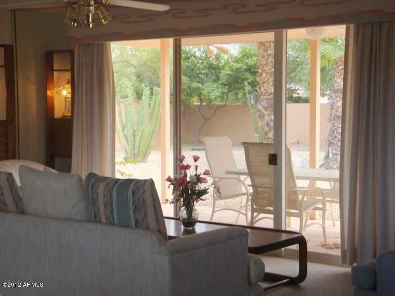 6933 East Doubletree Ranch Road Paradise Valley, AZ 85253 - Photo 8 of 30 a living room with furniture and floor to ceiling windows