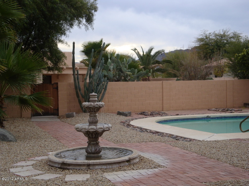 6933 East Doubletree Ranch Road Paradise Valley, AZ 85253 - Photo 10 of 30 a view of a fountain in the middle of a yard