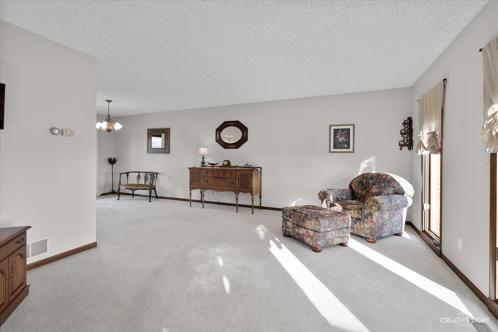 8S840 Dugan Road Big Rock, IL 60511 - Photo 4 of 31 a living room with furniture and a chandelier