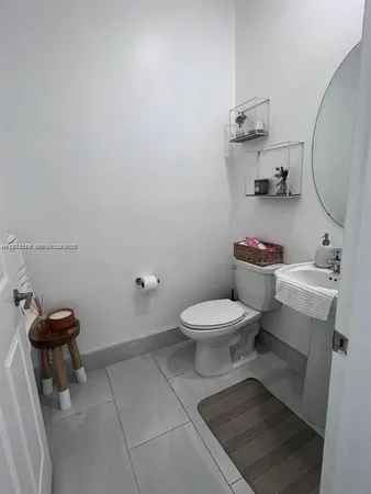 a bathroom with a toilet and a sink