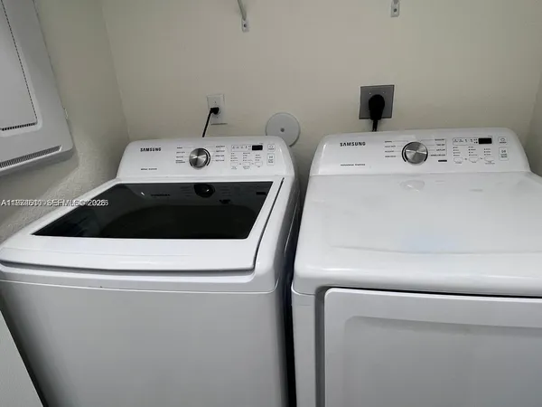 a utility room with dryer and washer