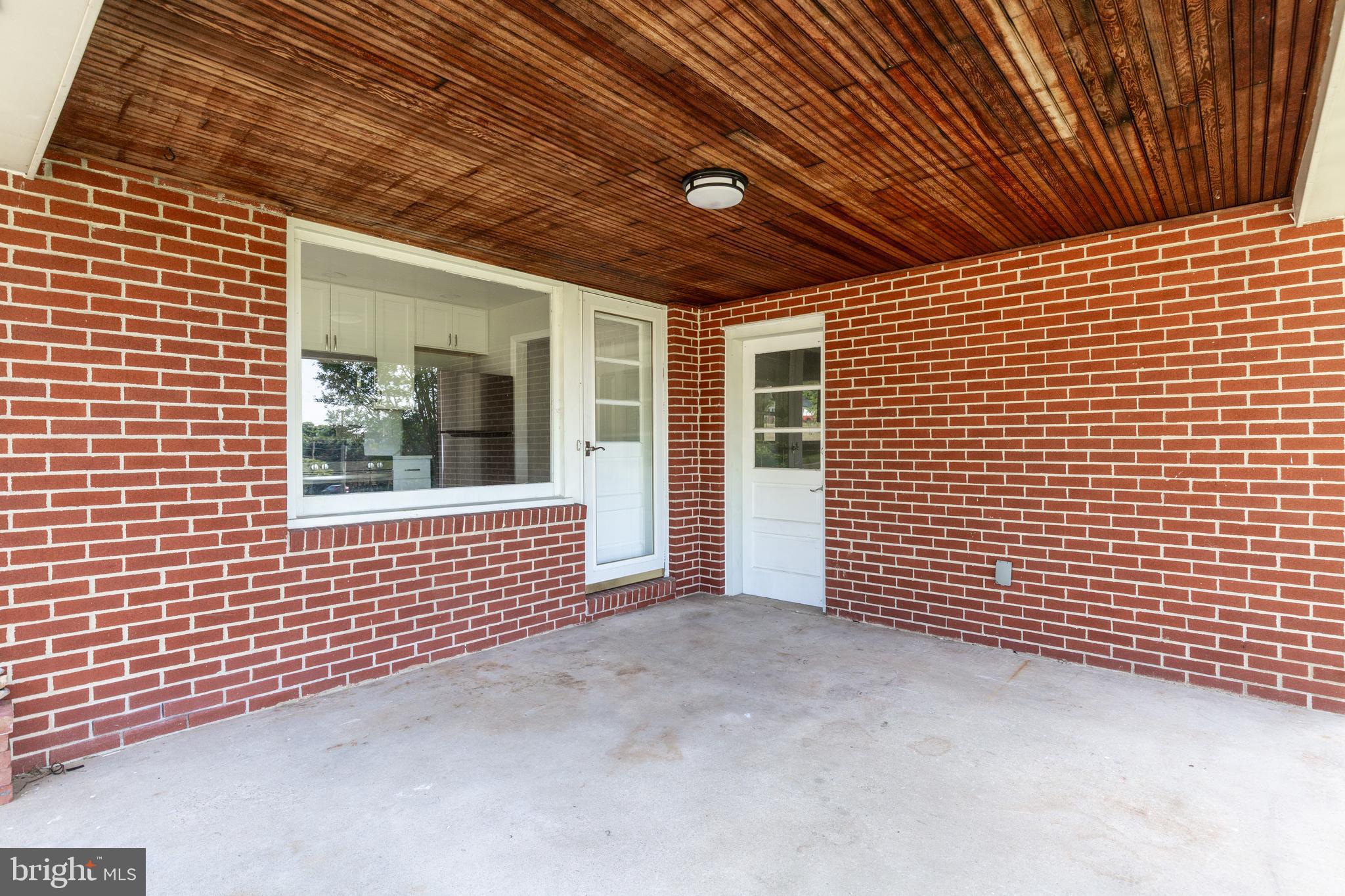 15022 Hanover Pike Upperco, MD 21155 - Photo 30 of 32 Covered patio off kitchen with access to garage