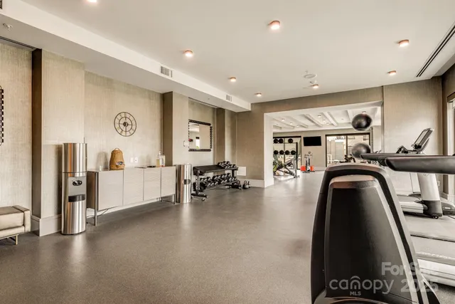 a view of a living room with furniture and a large window