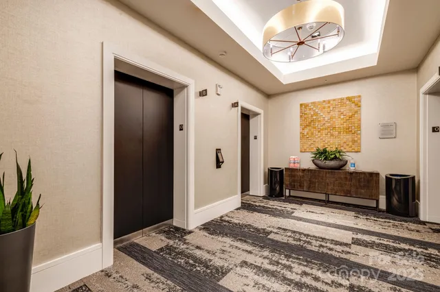 a bedroom with a bed and a mirror on the dresser