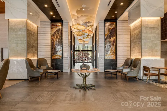 a work room with furniture and floor to ceiling window