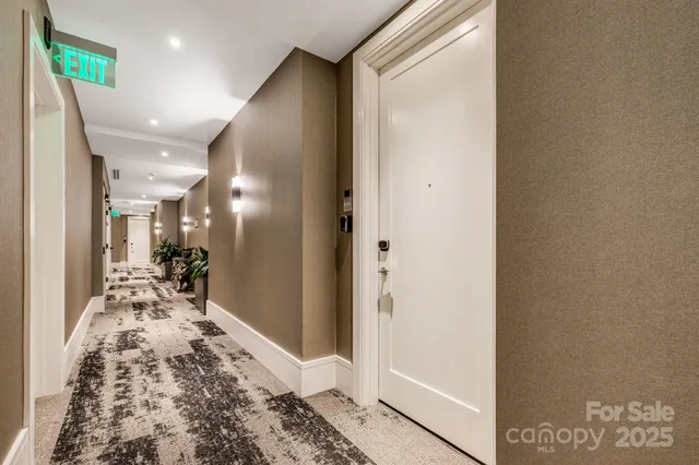 a view of a hallway with living room