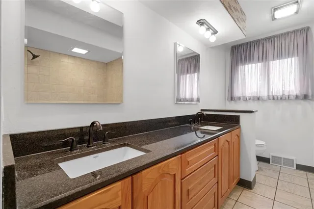 a close view of sink and cabinets