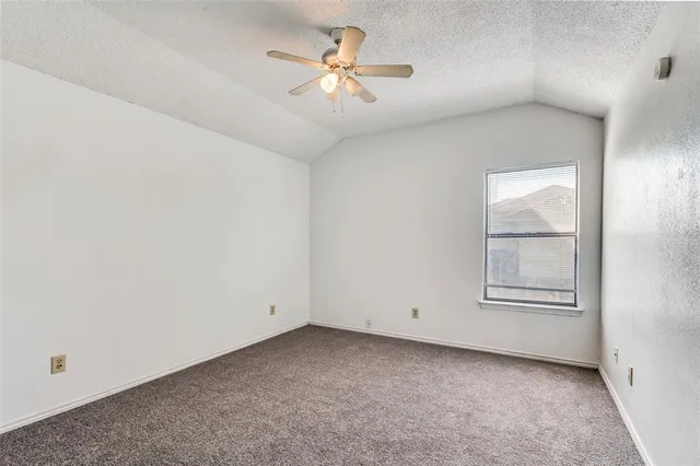 a kitchen with stainless steel appliances a sink a stove a refrigerator and cabinets