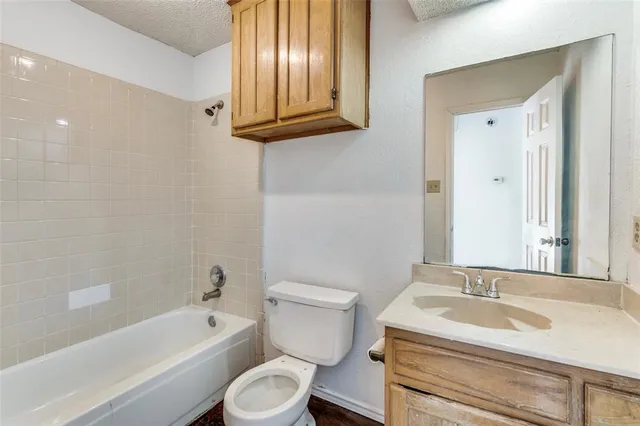 a utility room with sink dryer and washer
