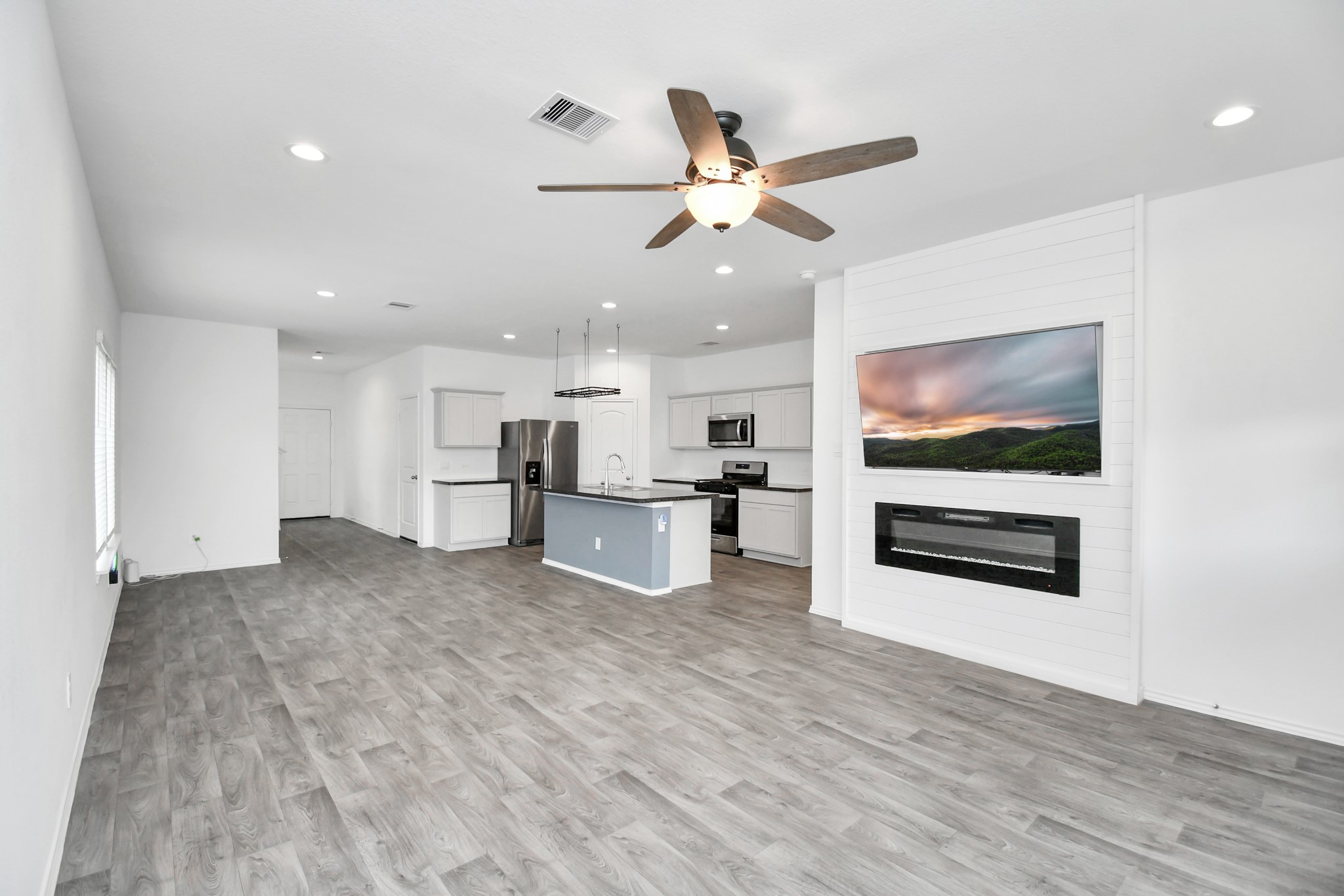 5443 Pinetree Crescent Ln Spring Spring, TX 77373 - Photo 13 of 43 a view of kitchen with wooden floor and window