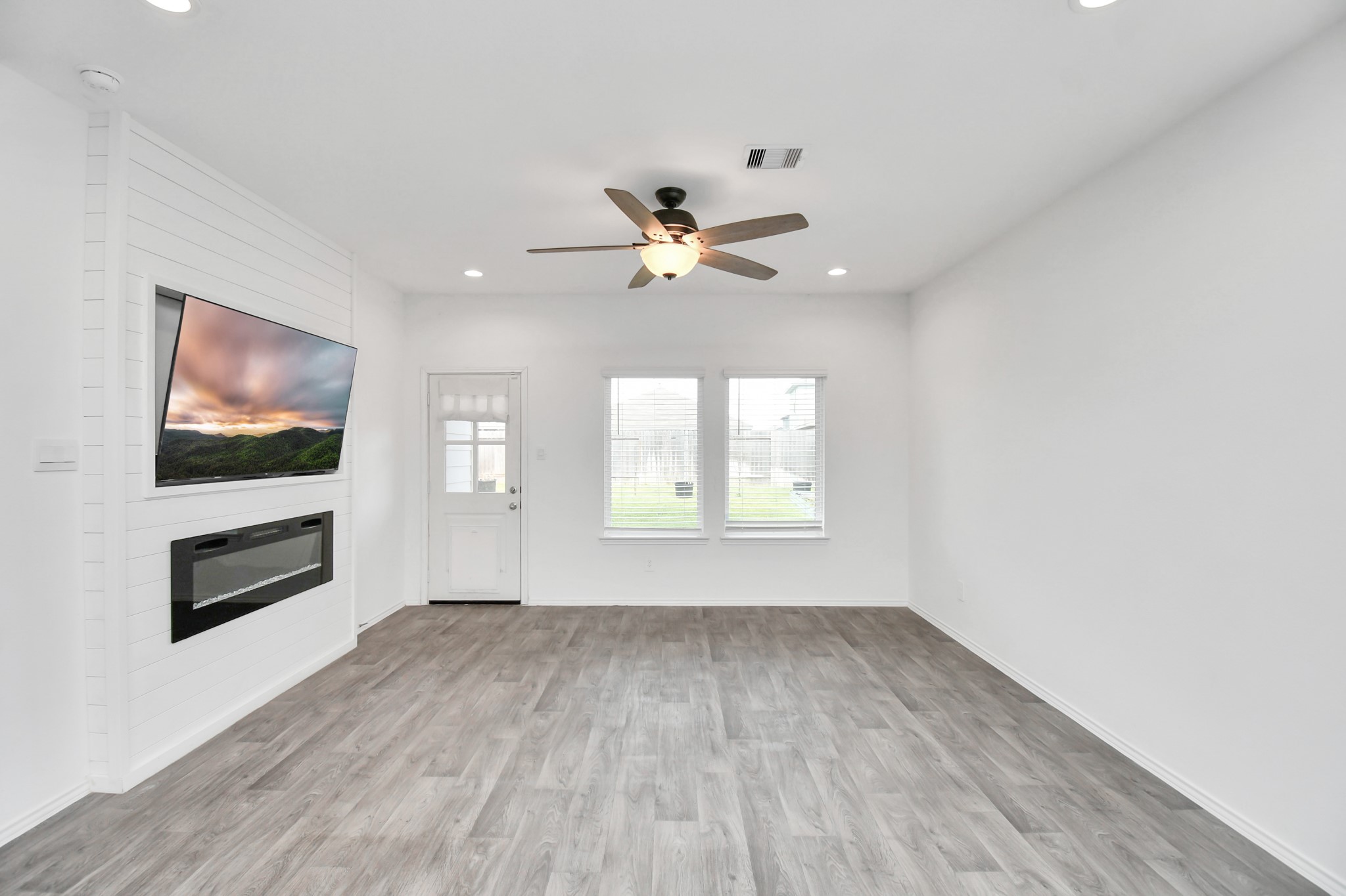 5443 Pinetree Crescent Ln Spring Spring, TX 77373 - Photo 15 of 43 wooden floor in an empty room with a window