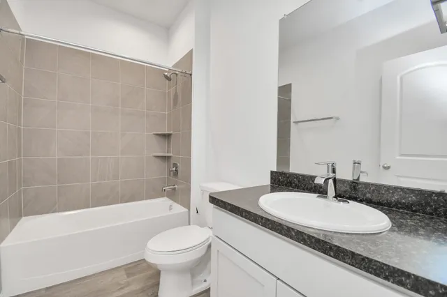 a bathroom with a sink toilet a bathtub and a shower