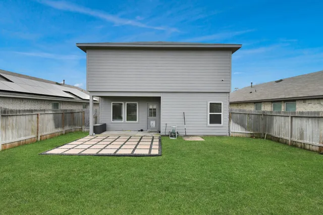a view of a backyard of the house