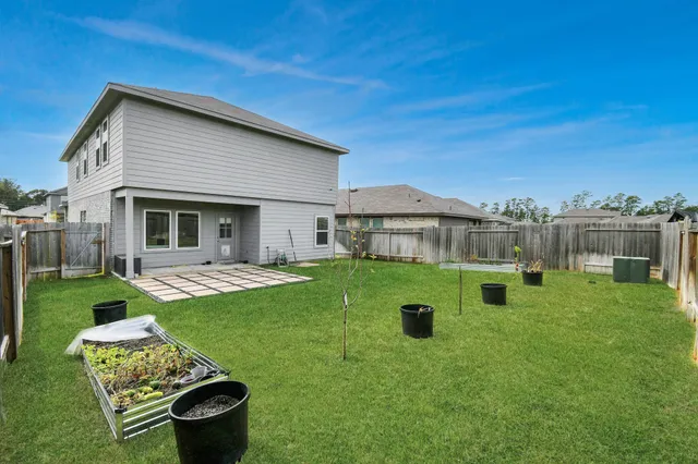 a front view of a house with porch and garden