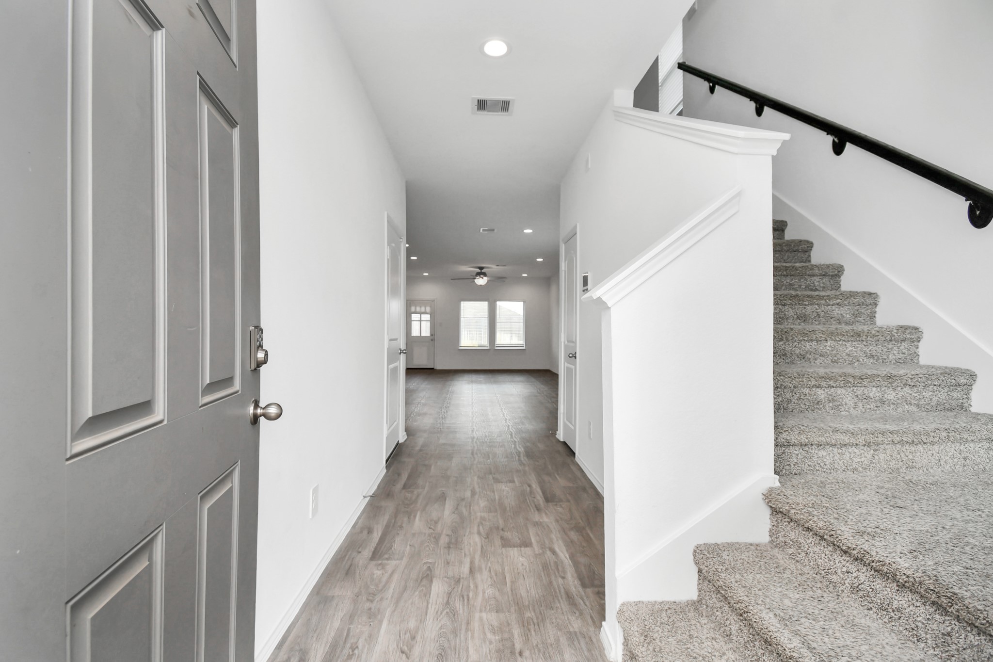5443 Pinetree Crescent Ln Spring Spring, TX 77373 - Photo 5 of 43 a view of a hallway with wooden floor and staircase