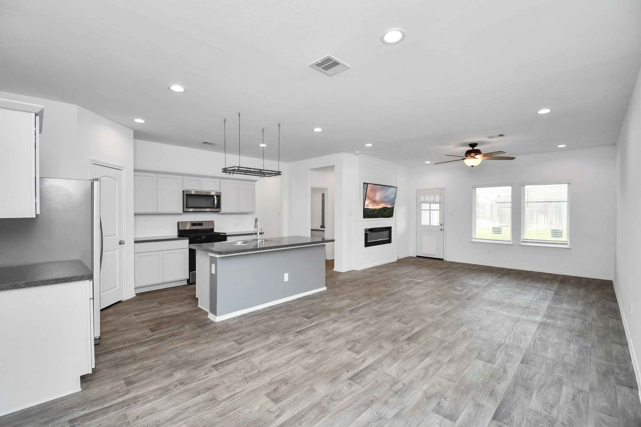 5443 Pinetree Crescent Ln Spring Spring, TX 77373 - Photo 7 of 43 a large kitchen with cabinets and stainless steel appliances