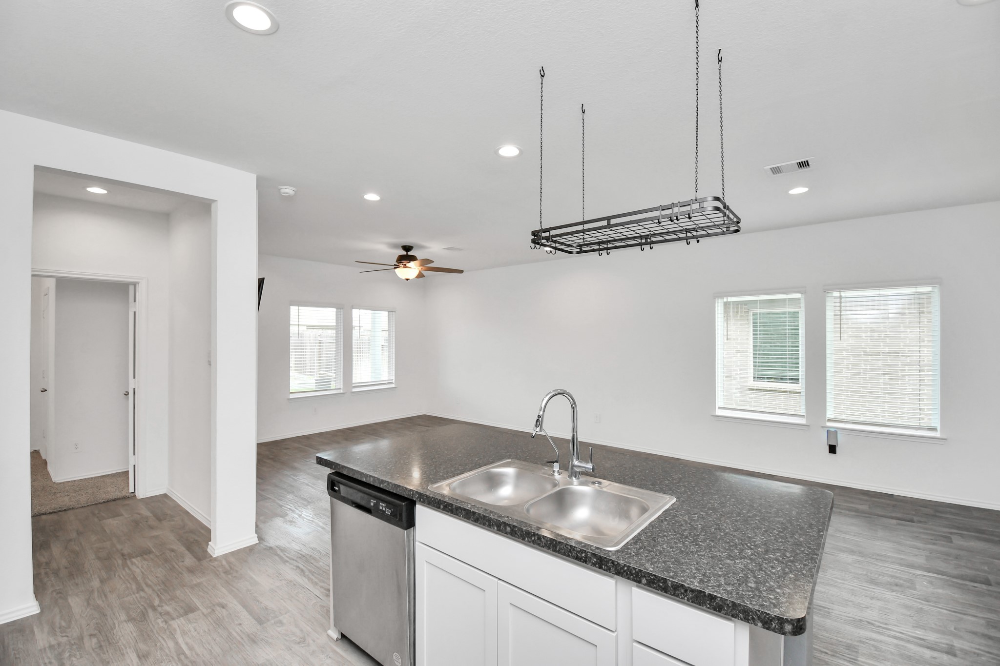 5443 Pinetree Crescent Ln Spring Spring, TX 77373 - Photo 10 of 43 a kitchen with stainless steel appliances granite countertop a sink a oven and a granite counter tops with white cabinets