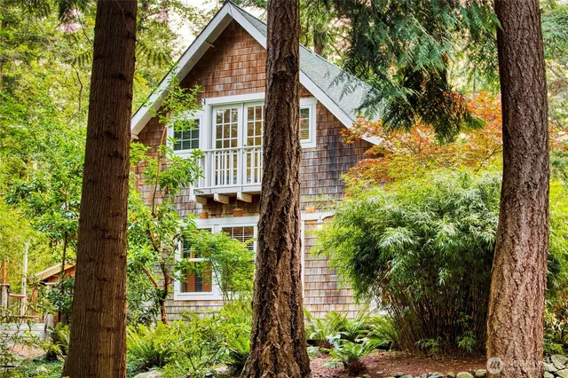 a view of a house with balcony and garden