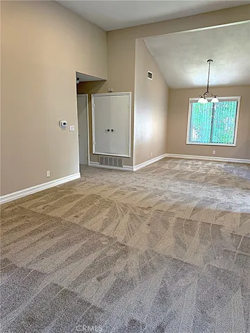 a view of an empty room with stairs