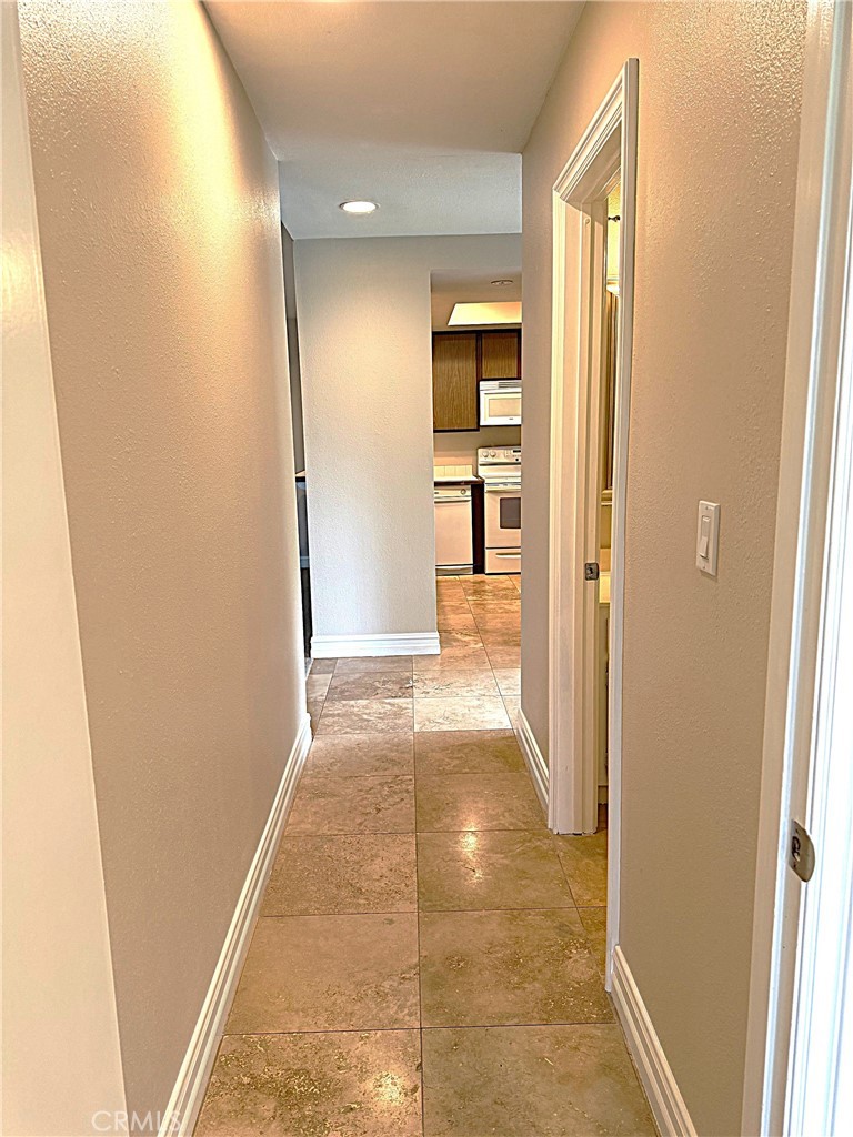 545 South Ranch View Circle, Unit 97 Anaheim Hills, CA 92807 - Photo 17 of 33 a view of a hallway with wooden shelves