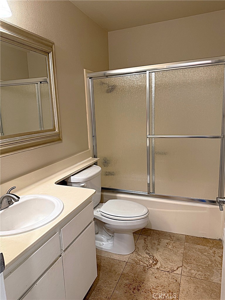 545 South Ranch View Circle, Unit 97 Anaheim Hills, CA 92807 - Photo 21 of 33 a bathroom with a sink toilet and shower