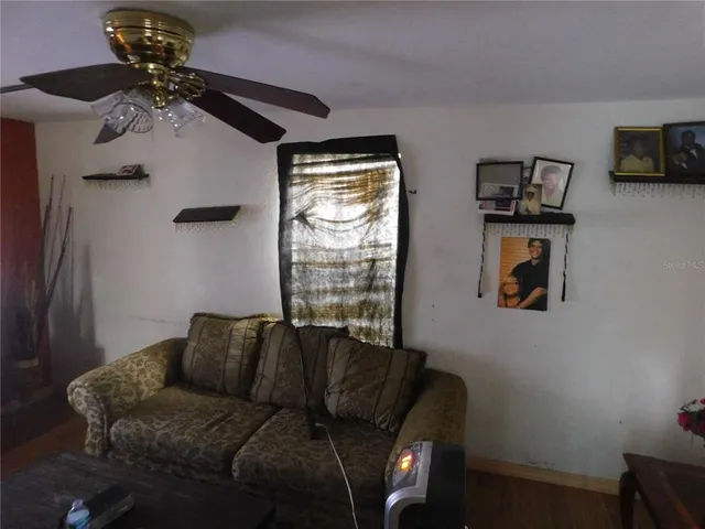 a living room with furniture and a window