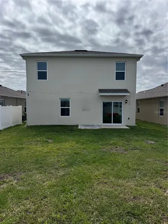 a front view of house with garden