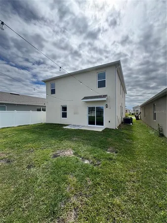 a backyard of a house with lots of green space